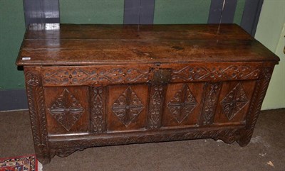 Lot 678 - An 18th century carved oak coffer