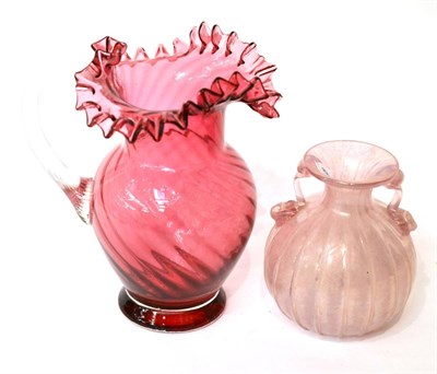Lot 13 - A cranberry glass jug and a glass lustre vase