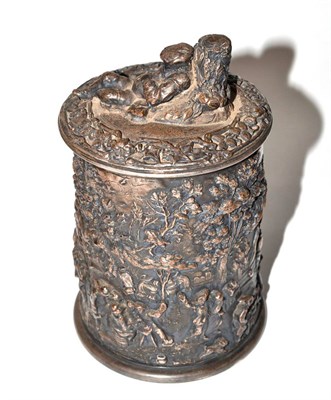 Lot 23 - An electrotype tobacco jar and cover decorated in relief with woodland landscape scenes and figures