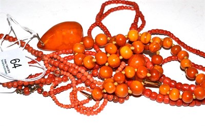 Lot 64 - A Victorian coral ring, three coral necklaces, an amber necklace and an amber drop pendant