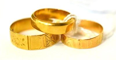 Lot 77 - Three 18ct gold band rings