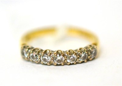 Lot 107 - A seven stone diamond set ring stamped '750'