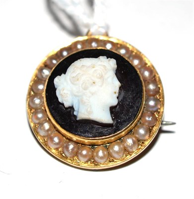 Lot 112 - A hardstone cameo brooch surrounded by split pearls