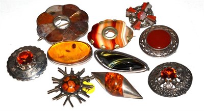 Lot 125 - Ten brooches including a Miracle Scottish agate mounted Celtic cross, Edinburgh silver thistle...