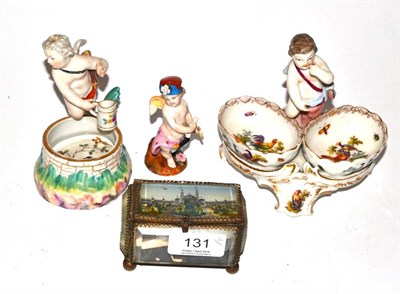 Lot 131 - A 19th century German double salt, two Continental figures and a Victorian glass box (4)