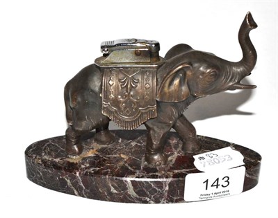 Lot 143 - An elephant form table lighter