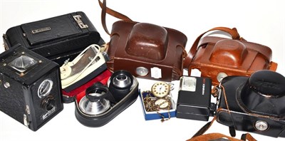 Lot 154 - Five various cameras, a light meter, a flash, two lenses, a silver fob watch and another