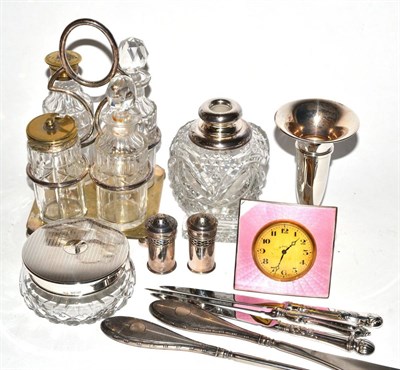 Lot 161 - A silver enamel strut timepiece, two silver peppers, silver and glass jar and cover inscribed...