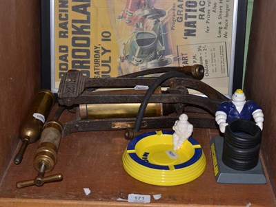 Lot 171 - A foot pump, two grease guns, a Michelin ashtray, spill holder and two prints of Brooklands posters