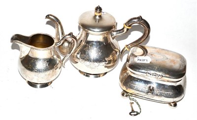 Lot 207 - A 19th century German silver teapot, matching cream jug and associated sugar basin