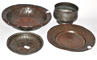 Lot 210 - Four early 19th century middle eastern copper dishes and vessels engraved with sanskrit, by...