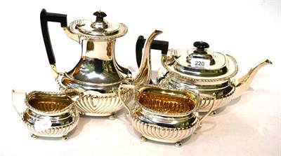 Lot 220 - A Late Victorian four piece silver tea service by Martin Hall & Co Ltd, with part gadrooned...