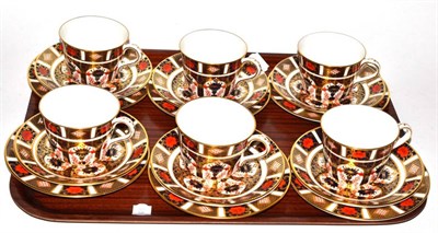 Lot 236 - A set of six Royal Crown Derby Imari tea cups, saucers and side plates, pattern number 1128