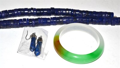 Lot 251 - A lapis lazuli necklace with earrings and a jade type bangle