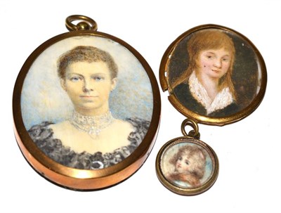 Lot 257 - An Edwardian oval portrait miniature on ivory, depicting a young woman, bust length, wearing a...