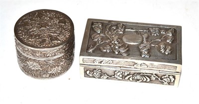 Lot 281 - A Chinese silver box by Wing Fat decorated with blossoms together with another Oriental white metal