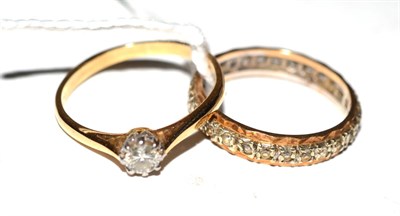 Lot 283 - A diamond solitaire ring and an eternity ring