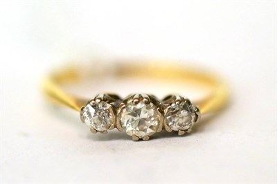 Lot 293 - A three stone diamond ring stamped '18CT'