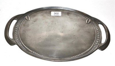 Lot 302 - Archibald Knox (1864-1933) for Liberty & Co., a pewter twin-handled tray, model No.0311, cast...