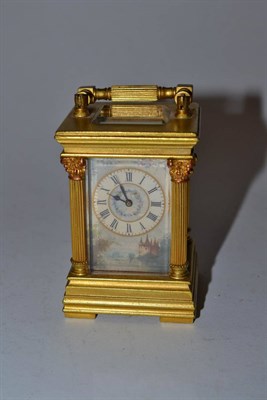 Lot 321 - Miniature carriage clock decorated with porcelain panels, in gilt brass case