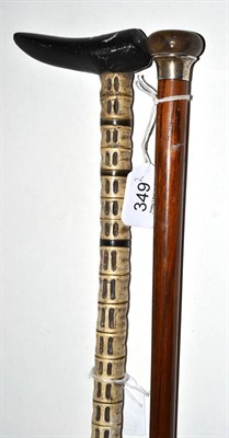 Lot 349 - A shark's vertebrae walking cane and a cane with a silver collar (2)