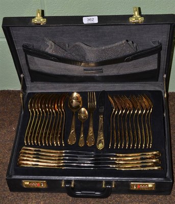 Lot 362 - A German gilt metal cutlery service for twelve place settings (cased)