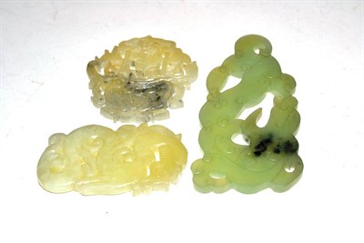 Lot 392 - Three carved jade discs, one in the form of a dragon (3)