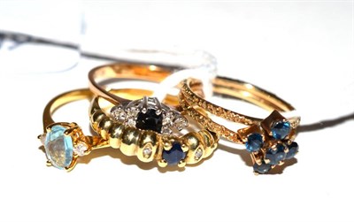 Lot 400 - Four stone set dress rings