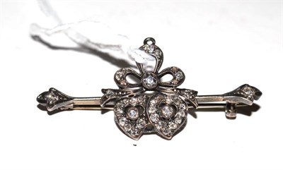 Lot 407 - A ribbon tied diamond set bar brooch