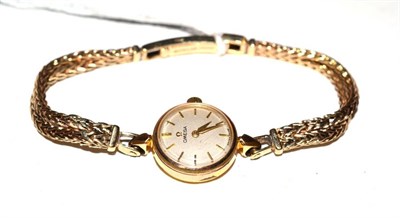 Lot 428 - A lady's plated wristwatch, signed Omega, on a later 9ct gold bracelet