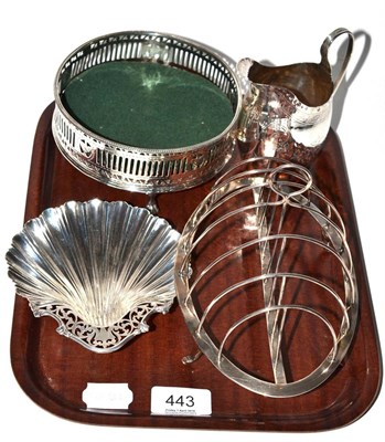 Lot 443 - A silver shell form trinket dish, silver six division toast rack, silver bottle coaster (a.f.)...