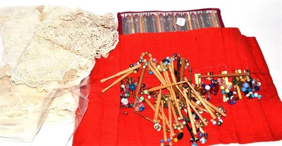 Lot 447 - A collection of modern lace bobbins and lace