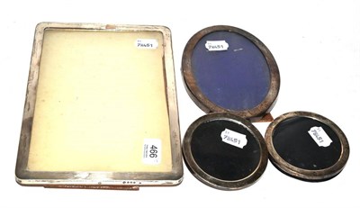 Lot 466 - Rectangular silver photograph frame, an oval silver photograph and a pair of circular silver...