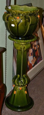 Lot 494 - An early 20th century Bretby Art Deco pottery jardiniere on stand, moulded in simulation of...