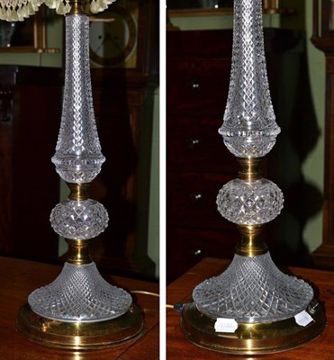 Lot 496 - A pair of cut glass and brass table lamps