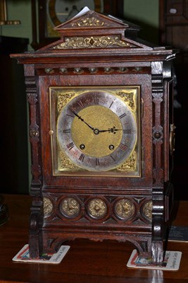 Lot 497 - A late 19th century oak cased mantel clock, with Lenzkirch movement