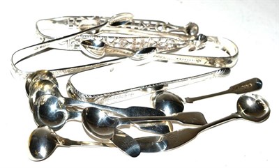 Lot 506 - A group of seven Newcastle silver salt spoons together with a pair of silver tongs marked for...