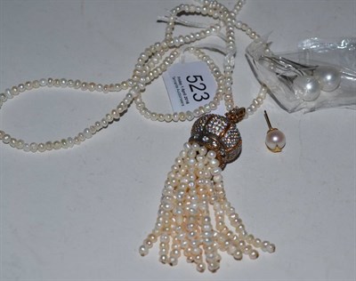 Lot 523 - A cultured pearl necklace with tassel drop and a pair of drop earrings