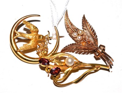 Lot 526 - A 9ct gold swallow brooch and a garnet brooch and another (3)