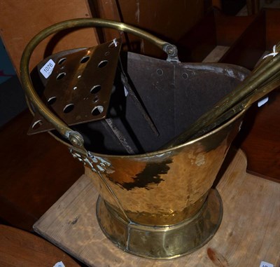 Lot 1076 - A 20th century brass coal bucket and fire irons with a stand (5)