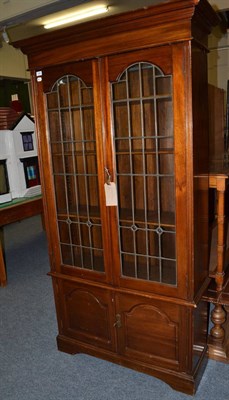 Lot 1080 - An Edwardian mahogany glazed bookcase