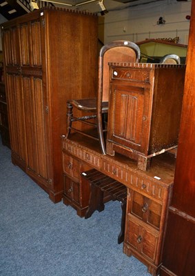 Lot 1081 - A suite of 1920's oak bedroom furniture comprising: wardrobe, dressing table, bedside cupboard...