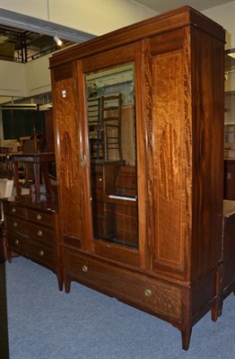 Lot 1085 - A two piece Edwardian inlaid mahogany bedroom suite comprising mirror fronted wardrobe and dressing