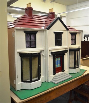 Lot 1089 - A large doll's house