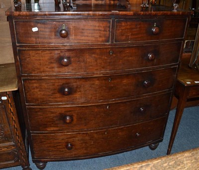 Lot 1093 - A Victorian mahogany bow fronted five height chest of drawers together with a toilet mirror of...