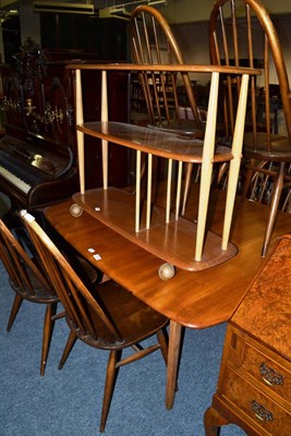 Lot 1100 - An Ercol kitchen table, six chairs and a three tier stand (8)