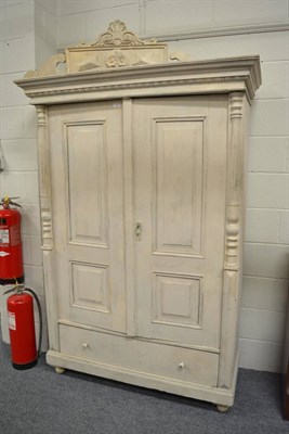 Lot 1106 - A painted pine panelled cupboard