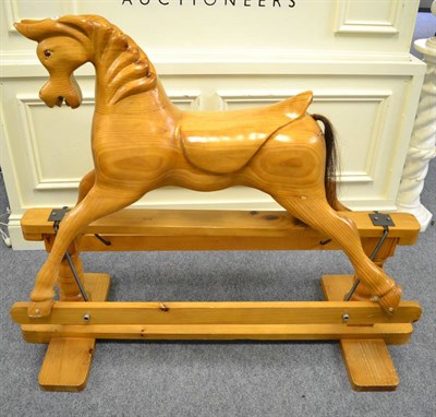 Lot 1117 - A rocking horse on a trestle base