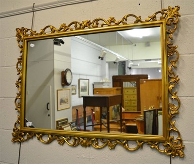 Lot 1156 - A reproduction gilt framed wall mirror