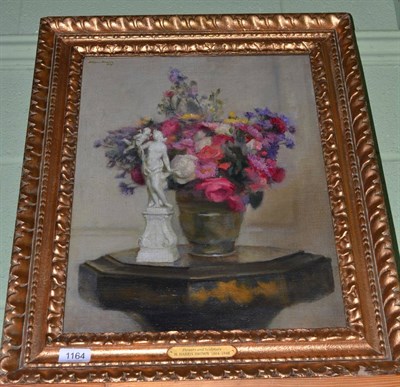 Lot 1164 - H. Harris Brown (Mid 20th century) Still life of assorted flowers with a figurine, signed and dated